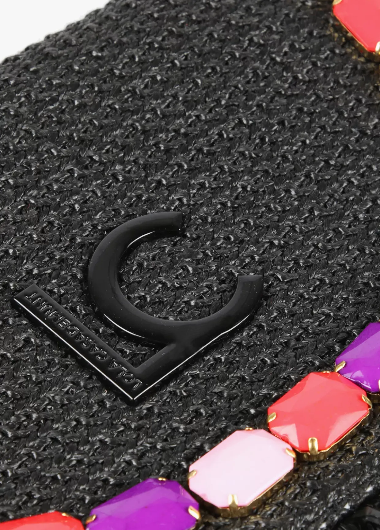 Cartera de mano con piedras de color