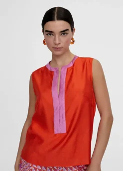 Top bicolor con aberturas
